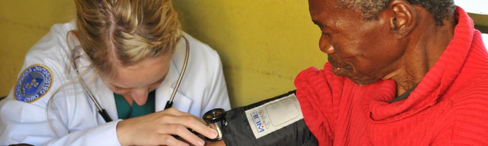 Student taking blood pressure in Botswana